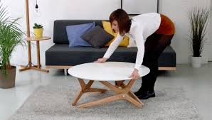 Well, not only a coffee table, but a table that can go from the height of a coffee table to a dining the way this design works is the table can be used at two different heights. Boulon Blanc Transforms From Coffee Table To Dining Room Table Using Helicoid Mechanisms 6sqft
