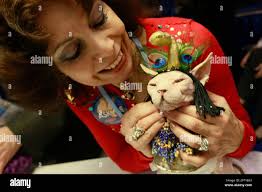 Sandy Adler of Westchester, N.Y. pets her 13-year-old Sphynx Hale Bop  during the "Meet the Breeds" event at the Jacob Javits convention center,  Saturday, Oct. 17, 2009 in New York. The event