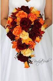 Blue and orange wedding bouquet. Cascading Fall Wedding Bouquet With Dark Red Orange And Yellow With Berries And Fall Map Red Bouquet Wedding Fall Flower Wedding Bouquets Fall Wedding Flowers