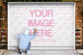 Download Man Painting Graffiti On A Garage Door Mockup Mediamodifier