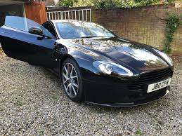 Image result for Onyx Black 2011 Aston Martin