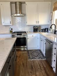 Working your way from the top to the bottom, run the hose across every surface of your cabinets to remove the sawdust. Refinish Your Kitchen Cabinets Like A Pro Diy Project