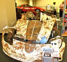 crushed cars, closing sinkhole