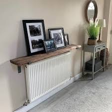 While a savvy diyer or woodworker can totally take this radiator cover project on, smith recommends that novices reach out to a professional carpenter or a radiator cover fabricating company to create custom covers. 15 Radiator Shelf Ideas No More Hiding In The Warm Season