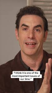 Sacha Baron Cohen Flight Attendant Scene Explained