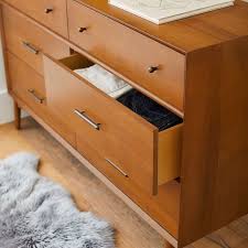 I mentioned my new love to my husband and he then i covered over the holes left from the drawer pull, so i could put 2 different pulls on in 2 different spots, again giving the illusion of more drawers. West Elm X Pbt Mid Century 6 Drawer Wide Dresser Pottery Barn Teen