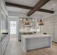 Any time deciding on any backsplash, you will have to get it accentuate the specific functions in your kitchen area, however, not always the particular kitchen appliances, simply because they might alter before too long. Black And White Mosaic Cooktop Backsplash With White Kitchen Hood Transitional Kitchen