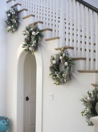This home has a tasteful nautical theme, with a thick rope winding around the banister along with here, a simply decorated white room is punctuated by a small christmas tree with no. 21 Best Staircase Christmas Decorations Holiday Staircase Ideas