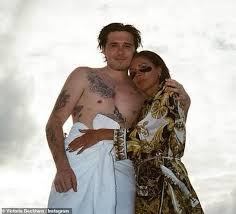 Born 17 april 1974) is an english singer, songwriter, fashion designer and television personality. We Miss You Victoria Beckham Cuddles Eldest Son Brooklyn In Sweet Snap Geeky Craze