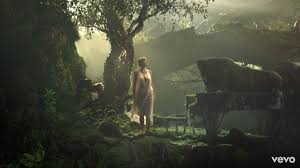 It shows swift performing on an old upright piano in a room with a flickering fireplace. Cardigan Taylor Swift Music Video Taylor Swift Taylor Swift Music Videos Taylor Swift Music