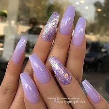 You can recreate this purple look or choose a glitter color of your choice. Pastel Lavender With Glitter On Coffin Nails Nail Artist Newmoonnailsbar Follow Them For Mo Purple Acrylic Nails Lilac Nails Purple Nails