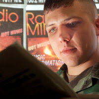 Sgt. Joni Jackson (left), a radio broadcaster, is ready