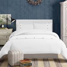 Including a bedframe, headboard, nightstand, and chest, each piece in this set is crafted from manufactured wood in a rustic truffle finish. Chehalis Bedroom Set Birch Lane