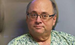 Staff surprises man with way to watch his twins' graduation from a hospital  room