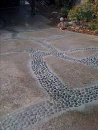 All driveways were not created equal. A Creative Low Cost Way To Deal With A Cracking Driveway First You Widen The Cracks A Little The Repair Concrete Driveway Concrete Driveways Driveway Design