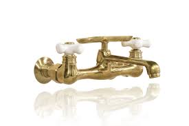 Kingston brass has a large selection of bridge kitchen faucets in a variety of styles and finishes. Natural Brass Wall Mount Short Swivel Spout Utility Bridge Faucet Porcelain Cross Handle Soap Dish