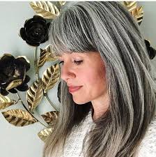 Around the age of 14, my hair started turning gray. Long Gray Hair Is Gorgeous At Any Age 50 Photos That Prove It Long Gray Hair Grey Hair Color Grey Hair With Bangs