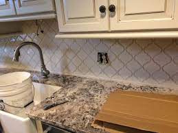 Jun 19, 2021 · achieving a modern farmhouse kitchen has never been easier than with these tin inspired peel and stick backsplash tiles the textured and dimensional tile has cool undertones and metallic accents that lend to its modern style. Msi Antique White Arabesque 10 5 In X 15 5 In X 8 Mm Glossy Ceramic Mesh Mounted Mosaic Wall Tile 1 13 Sq Ft Pt Aw Arabesq The Home Depot Arabesque Tile Backsplash Kitchen Antique White