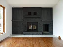 I also painted the tiles underneath the fireplace to get rid of the. How To Easily Paint A Stone Fireplace Charcoal Grey Fireplace Makeover Dans Le Lakehouse