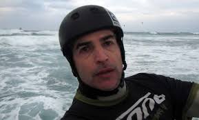 Windsurfers and Kite in the end of winter storm