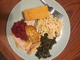 A dish made with a savoury sauce of melted cheese and various other ingredients and served hot (also called welsh rarebit). Mac Cheese Collard Greens Corn Bread Turkey With Cranberry Sauce Food Collard Greens Food Dishes