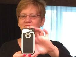 Woman who fell beneath train in East Lansing dies