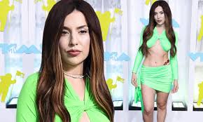 Ava Max shows off her toned tummy and chiseled legs in a bright green  outfit at the VMAs | Daily Mail Online