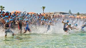 Triathletes compete for fastest overall completion time, racing each segment sequentially with the time transitioning between the disciplines included. Triathlon Wikipedia