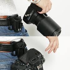 Description The Camera Holder Secures The Camera Firmly To The Photographer S Hip And Eliminates The Neck Shoulder And Back Strain Ca Dslr Camera Dslr Camera