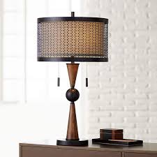 It's made with a solid wood base and has a brass bulb base, and is capped with a fabric empire shade in a neutral tone. Hunter Bronze And Cherry Wood Table Lamp 20r05 Lamps Plus