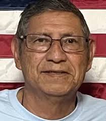 Reginald “Reggie” Zhuckkahosee, “PENETEWA” (walking towards a crowd)