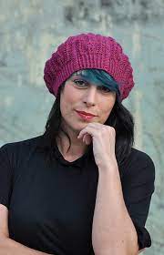 This beret is constructed in the style of a lace doily with a center start and repeating medallions. Bellefleur Lace Beret Knitting Pattern