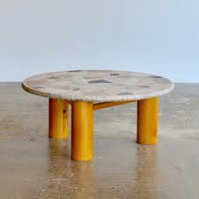 The guitar pick shaped table tops are mdf with a walnut oak veneer and paired with matte black metal legs. Transform Your Living Room With These Stylish Coffee Tables