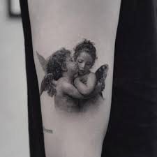 First Kiss Tattoo By Coldgraytattoo Cherub Tattoo Kiss Tattoos Cupid Tattoo