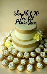 Check spelling or type a new query. Chocoberry Cakery A Two Tier Cake Adorned With Fresh Flowers Edible Gold Paint And Customised Acrylic Topper Bottom Tier Chocolate Cake Top Tier Lemon Pound Cake Three Dozen Mini Vanilla Cupcakes