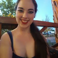 Gray striped kitten with blue collar outside Mojo's