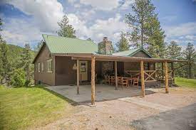 You'll find multiple bedrooms, laundry facilities and furnished living rooms, so you can have movie nights just like at home. Log Cabin On Mickelson Trail With View Of Black Elk Peak Hill City