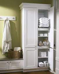 A bathroom linen storage cabinet creates an essential spot to organize all your linens. Inspiration Bench And Hooks Above With The Closet I Was Just Thinking My Bathroom Needed A Bench Today Linen Cabinets Bathroom Cupboards Bathroom Storage