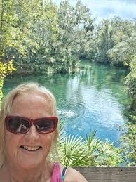 Should we go to the turtle center or Spott's Beach to swim with turtles?