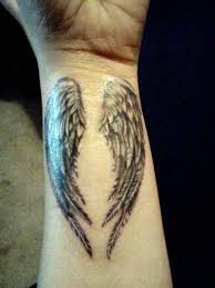 Black small angel wings tattoo for girls. 101 Best Angel Wings Tattoos Designs