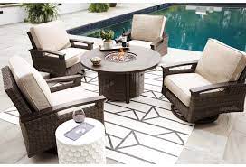 Gas fire pit table set resin wicker weave 4 chairs outdoor 50,000 btu burner new. Signature Design By Ashley Paradise Trail P750 776 Contemporary Round Fire Pit Table Furniture And Appliancemart Outdoor Fire Pits