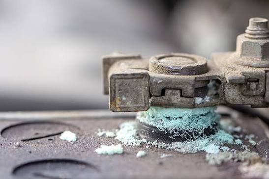 Checking corrosion and loose connections on car battery terminals| Pakwheels.com