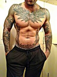 Attractive black and grey two gun tattoo on man stomach. The Peculiarities Of Tattoos For Men Best Tattoo Ideas