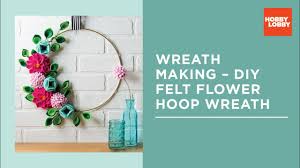 Monochrome beret is decorated with three metal hoops at the brim for a contemporary twist. How To Wreath Making Diy Felt Flower Hoop Wreath Hobby Lobby Youtube