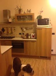 Modern wood cabinets with white quartz countertops and two islands. Quartersawn Oak Cabinets In A Modern Kitchen