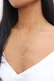 Maybe you would like to learn more about one of these? Small Gold Hamsa Hand Necklace And Gold Pave Evil Eye Necklace By Rani Co Hand Necklace Necklace Womens Necklaces