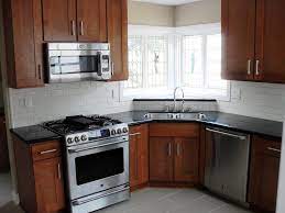 Arts and crafts kitchen lighting. Brentwood Sandalwood Shaker Cabinets Absolute Black Granite Counters And Backsplash Kitchen Dark Cabinets Backsplash For White Cabinets Shaker Style Cabinets