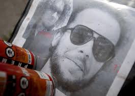 Saginaw artist Eric Schantz updates mural of friend, homicide victim Sean  Stennett