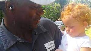 Ex Convict Finds Baby Crawling On Highway Alone Then He Holds His Phone Up To Her Ear Playing Gospel Music