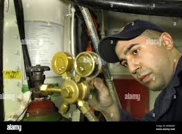 Hull maintenance technician fireman hi-res stock photography and images